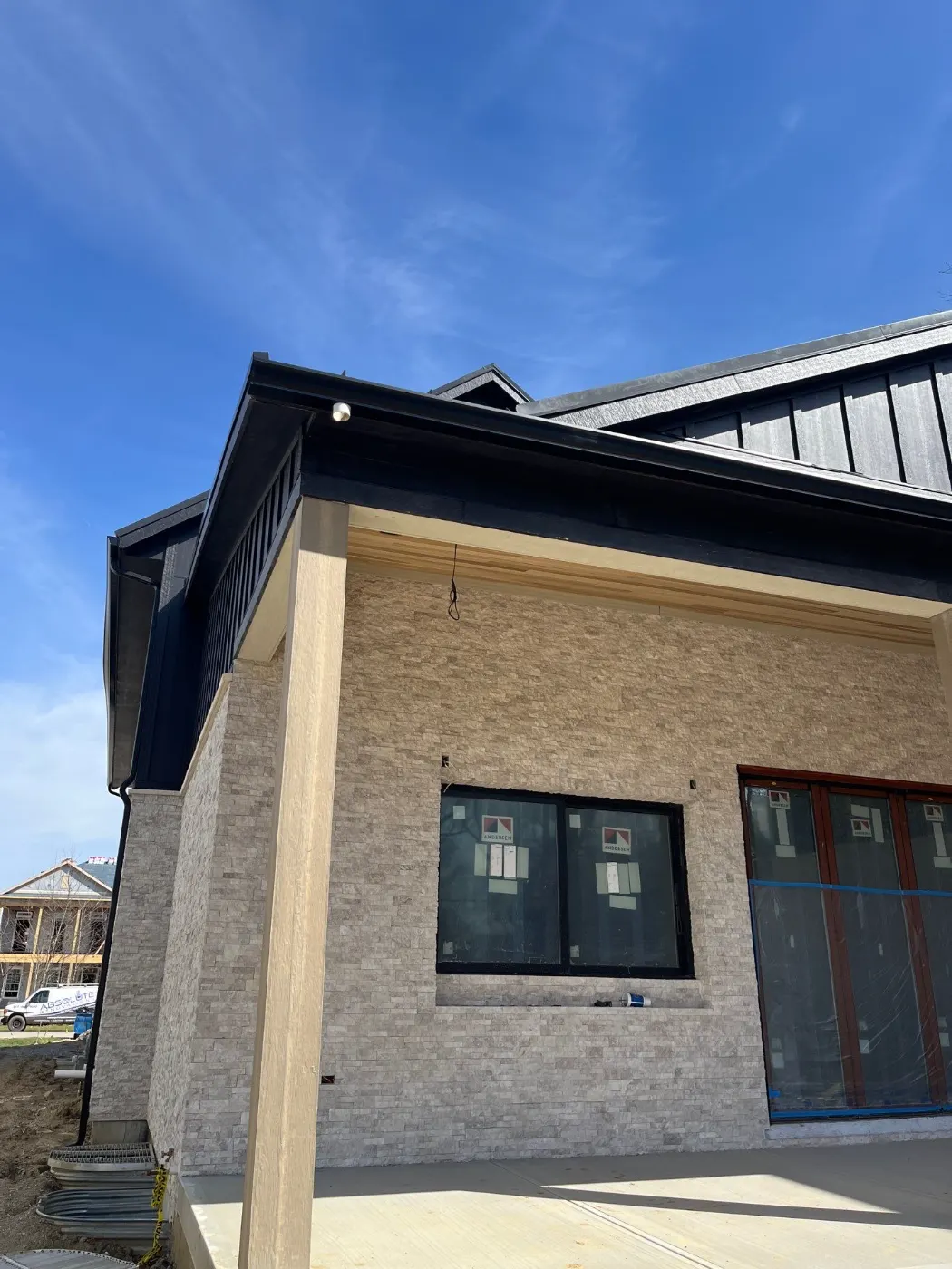 Tarping and dry-in on a Smokey Row Estates commercial roof
